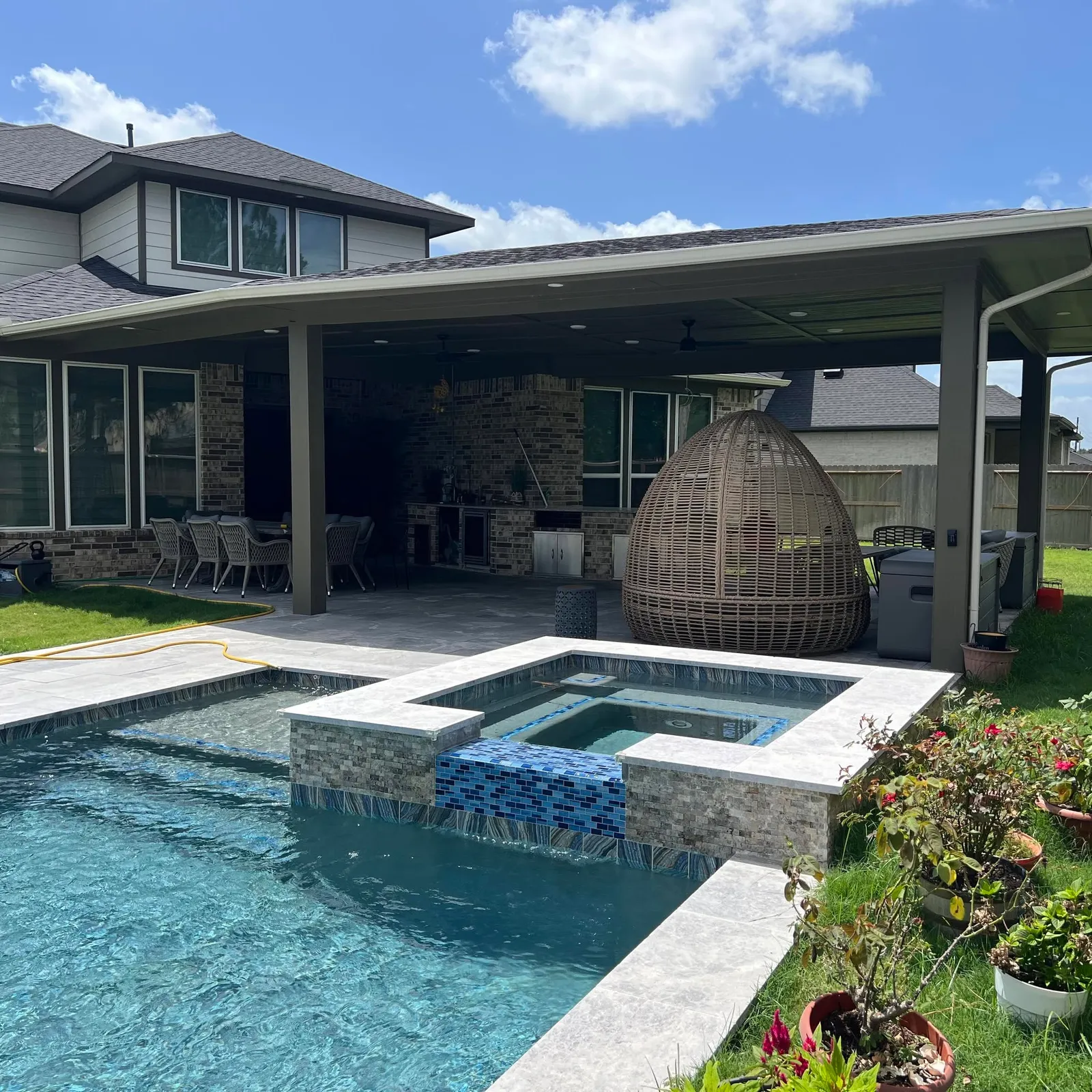 Resort-style pool and covered patio in Katy