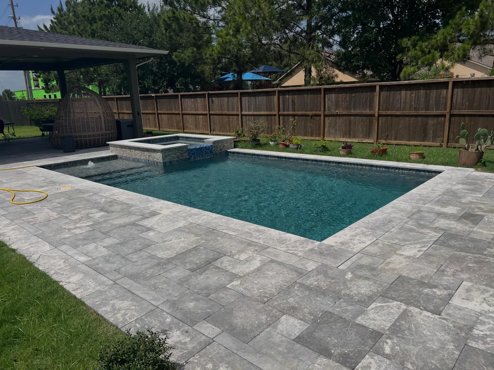 Raised stone wall by a pool
