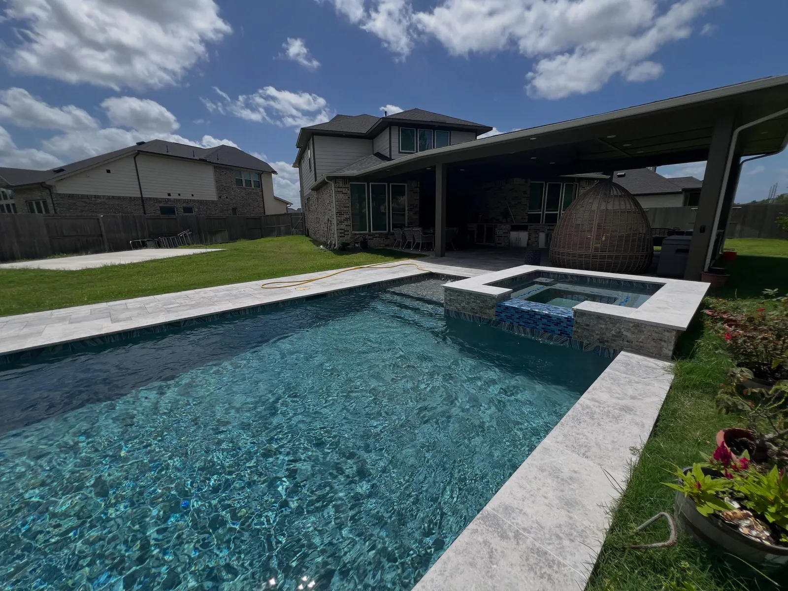 Custom pool with raised spa in Katy